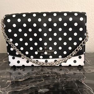 Black & white polka dot purse with silver chain strap & adjustable black strap.